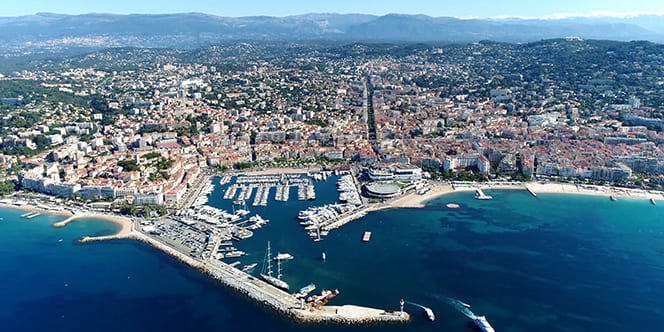 Where to Travel in May? Top 10 Destinations Worth Traveling (And Events to Attend) 5 High altitude aerial photo from helicopter showing Cannes a city located on French Riviera and host of annual Film Festival and known for its association with rich and famous Where to Travel in May? Top 10 Destinations Worth Traveling (And Events to Attend)