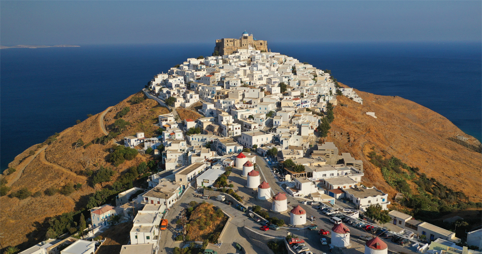 Greece’s Hidden Gems: 8 Lesser‑Known Islands & Cities Worth Exploring in 2026 5 greece hidden gems - Castle overlooking the deep blue Aegean sea in Chora of Astypalaia at sunset 4