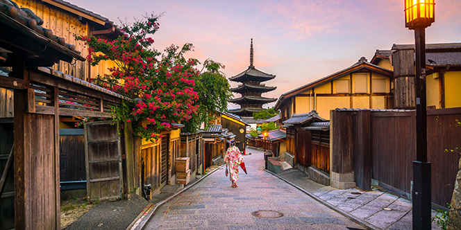 Where to Travel in July: 12 Places for Maximum Delight 5 Japanese girl in Yukata with red umbrella in old town Kyoto Japan Where to Travel in July: 12 Places for Maximum Delight