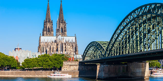 Germany Cultural Tour: Top Attractions & Things to Do in Germany 21 Cologne Cathedral and Hohenzollern Bridge through Rhine river in Cologne Germany Germany Cultural Tour: Top Attractions & Things to Do in Germany