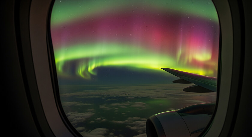 Unusual Flight Experiences: The Moments That Stay With You 2 northern lights from airplane window Unusual Flight Experiences: The Moments That Stay With You