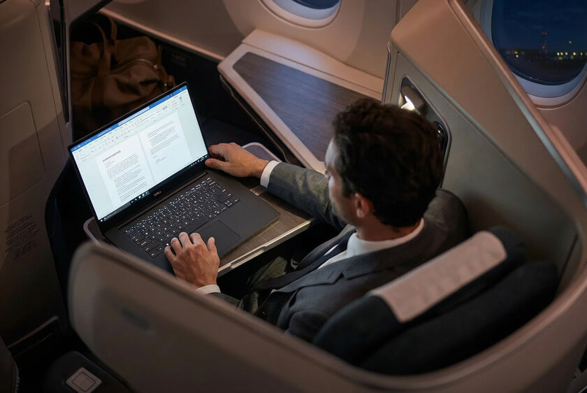 When Business Class Often Makes More Sense Than Economy 5 business class seat man working laptop airplane When Business Class Often Makes More Sense Than Economy
