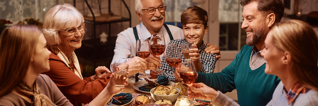 When to Book Flights for Holidays in 2026 4 family holiday dinner toast multigenerational celebration When to Book Flights for Holidays in 2026