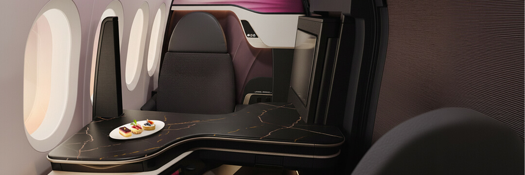 Qatar Airways' Qsuite Next Gen: What Changes in 2026 and Why It Matters 3 modern airplane business class seat with large window and meal