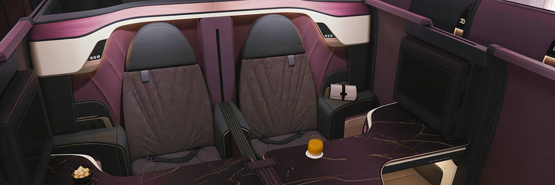 Qatar Airways' Qsuite Next Gen: What Changes in 2026 and Why It Matters 4 premium aircraft double seat business class cabin with table