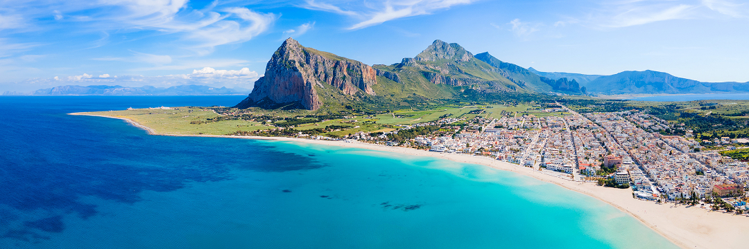 Best Beach Destinations in Italy (Luxury Guide 2026) 6 san vito lo capo beach sicily mountain view arangrant