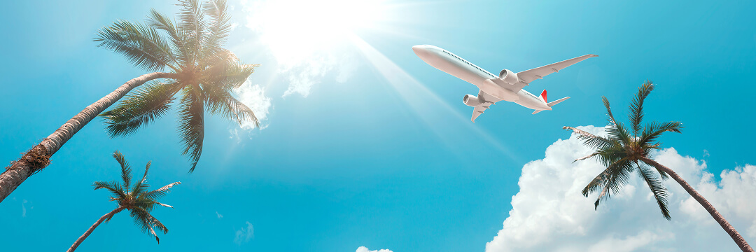 When to book flights for July–September 2026, before options become limited 3 tropical sky airplane palm trees summer travel vacation