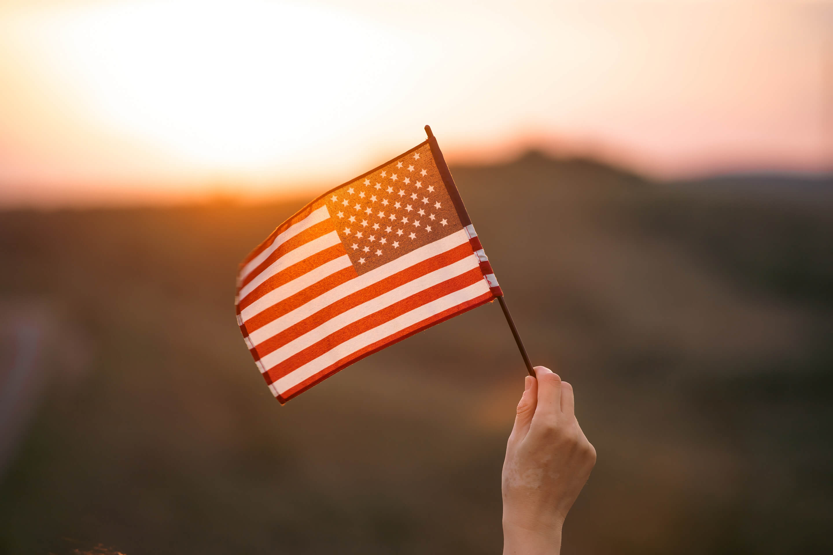 american flag sunset hand patriotic celebration