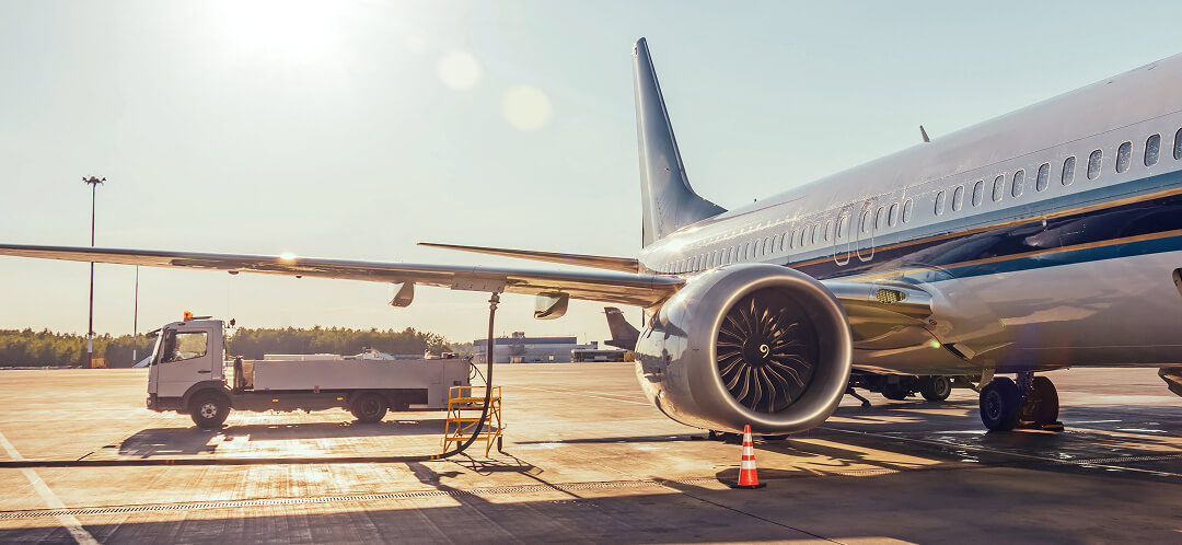 Why flying feels unpredictable in 2026, and what’s actually driving it 3 commercial airplane being serviced on airport tarmac
