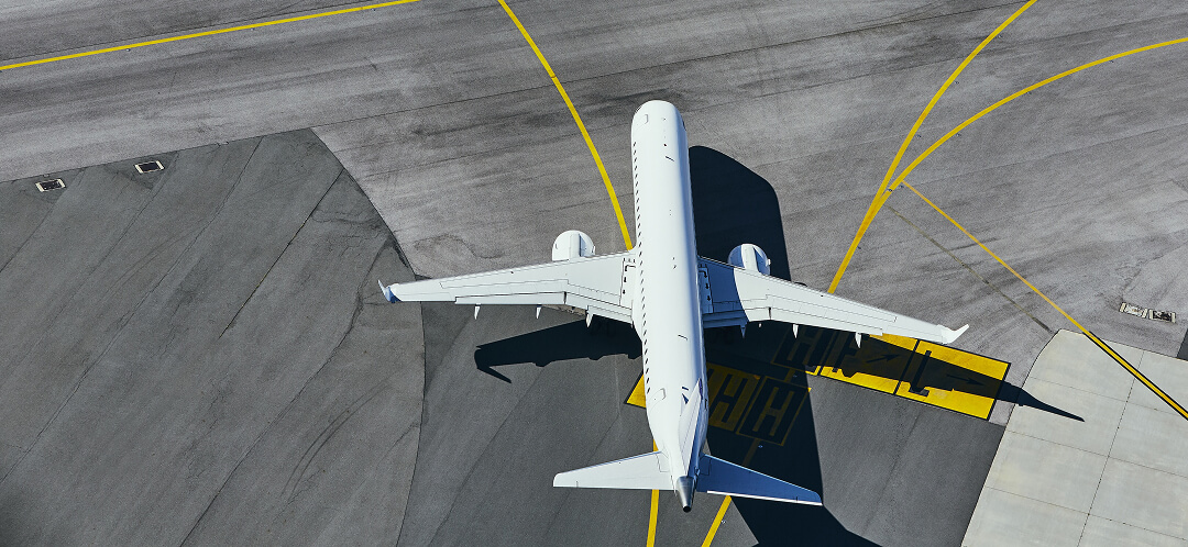 Does American Airlines still have first class? 7 airplane aerial view on airport taxiway